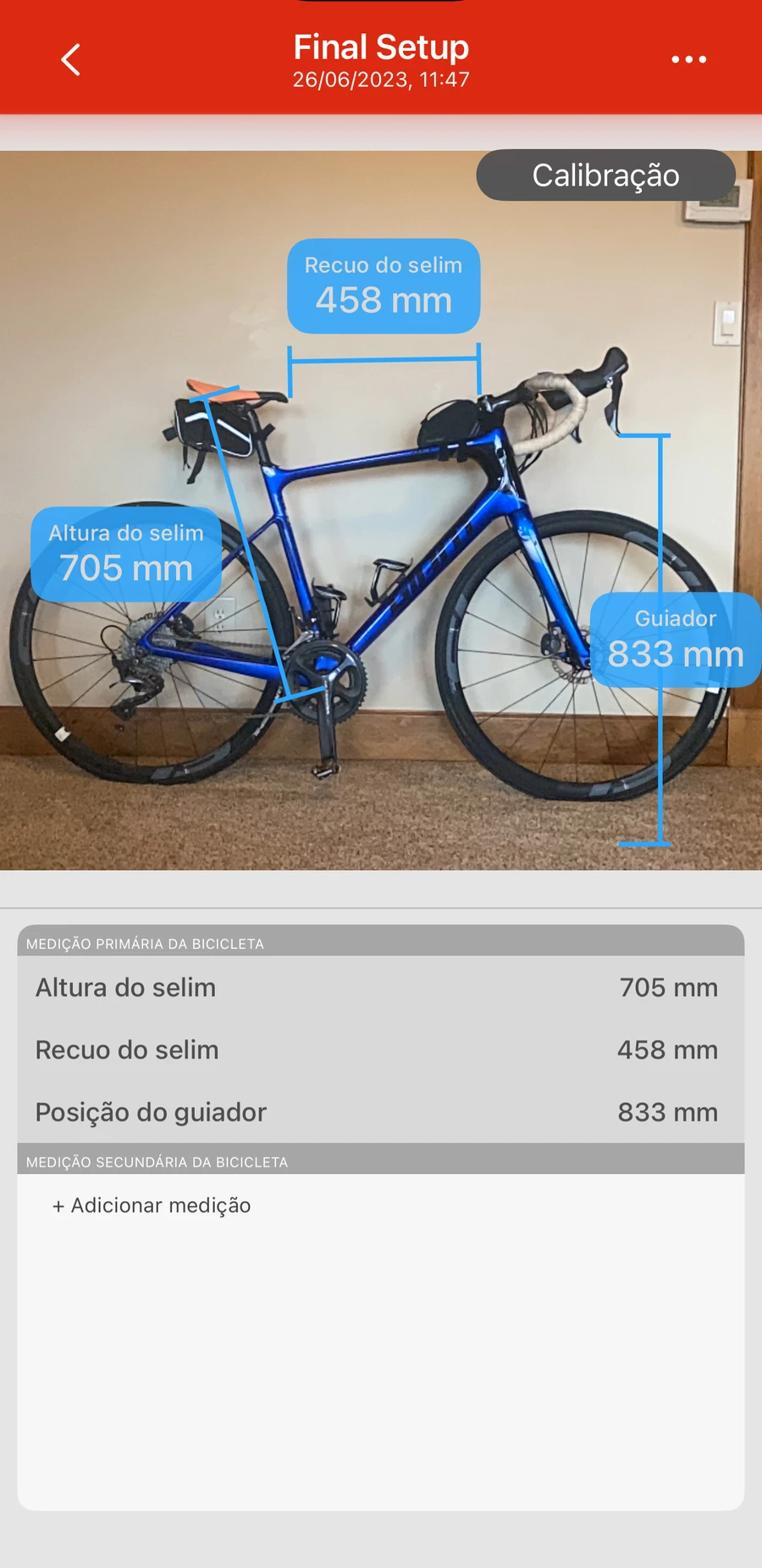 O ecrã de medição da bicicleta na Bike Fast Fit Elite: uma bicicleta fotografada com a altura do selim, o recuo do selim e a posição do guiador marcados e listados