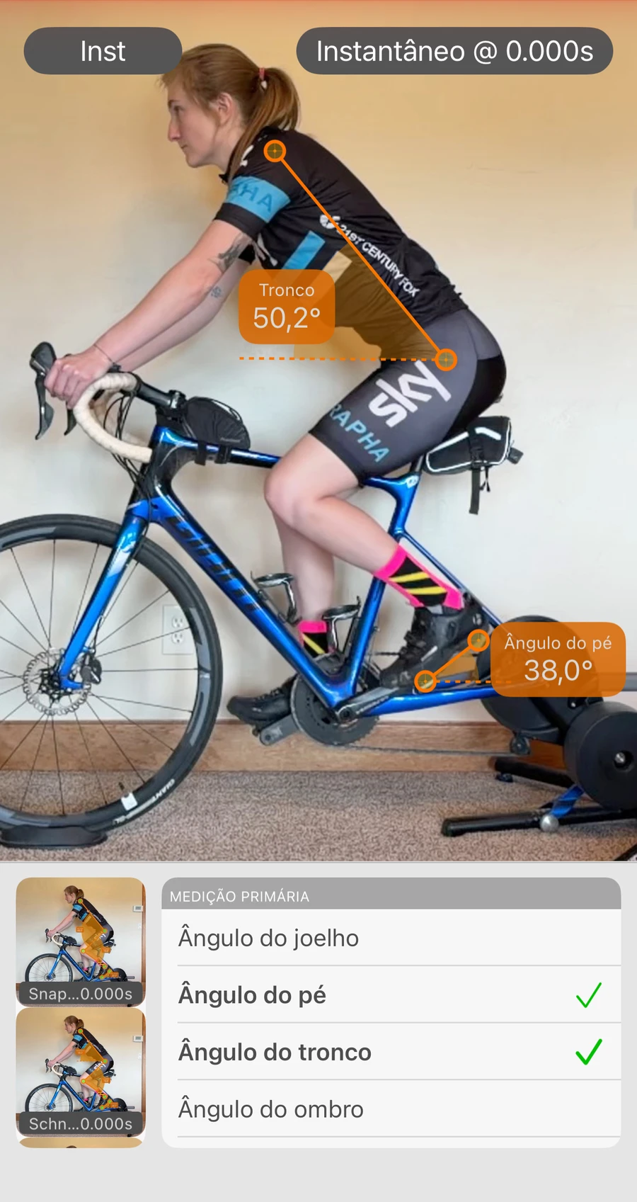 Um instantâneo da Bike Fast Fit Elite no segundo zero com os ângulos do tronco, do joelho e do pé medidos na imagem congelada, e a miniatura de um segundo instantâneo ao lado