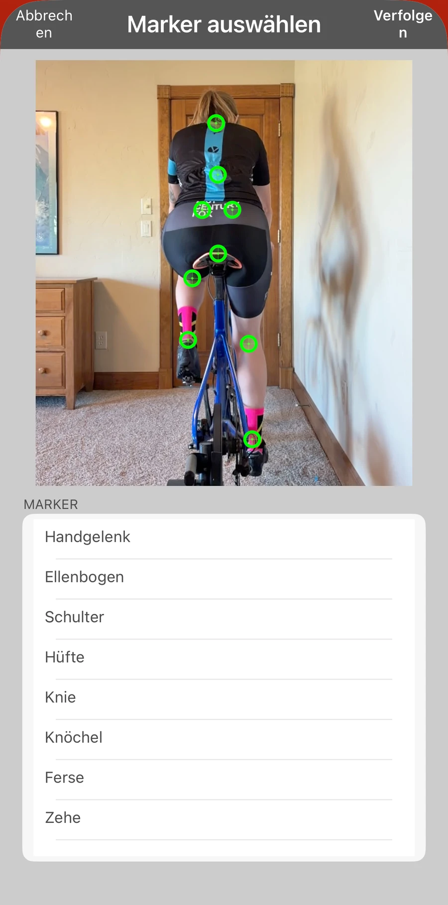 Der Marker-Auswahlbildschirm in Bike Fast Fit Pro: acht Trackingpunkte von Hand am Fahrer gesetzt, daneben die Liste Handgelenk, Ellenbogen, Schulter, Hüfte, Knie, Knöchel, Ferse und Zehe